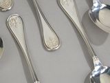 a lot of spoons and spoon spoons on the table