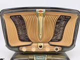 an old radio that is sitting on top of a table