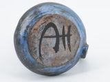an image of a blue and black vase with the word ha on it