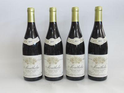 three bottles of wine are lined up on a table