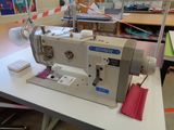 a sewing machine that is sitting on a table