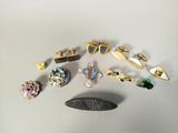 a lot of different types of jewelry on the table