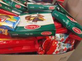 a box full of assorted snacks sitting on the floor