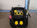 a black suitcase that has a yellow and yellow sticker on it
