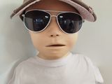 a baby wearing sunglasses and a hat with a hat on