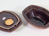 a small bowl with a lid and a smaller bowl with a lid