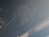 a man sitting on a bus looking out the window