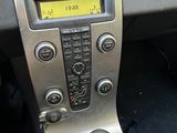a close up of a car ' s dashboard with a gear stick