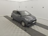 the small car is parked in the garage on the checkered floor