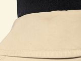 the back of a woman ' s tan skirt with a black top and a black top