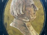 painting of a bust of a woman in a black frame