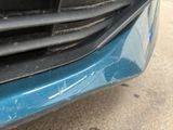 a close up of a car ' s front bumper and grille