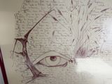 un dessin du visage d'un homme sur une feuille de papier