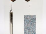 a picture of a picture of a pair of earrings hanging from a wire