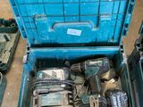 a blue tool box with tools in it on the floor