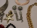 many different types of jewelry on a table