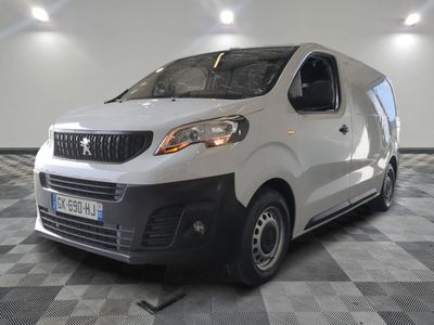 the white van is parked on a checkered floor in a room