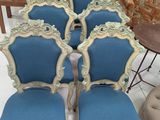 several chairs and tables are arranged in a room with a table and chairs