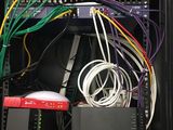 a rack with a bunch of wires in it