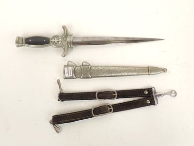 three different types of knives on a white surface