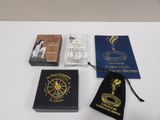three books, a passport, and a book bag sitting on a table