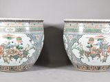 pair of chinese famille vases with figures and flowers