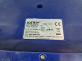a close up of a label on the back of a blue car