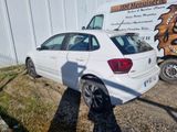 a white car that is parked in front of a building