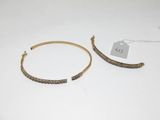 pair of gold tone hoop earrings with beaded details