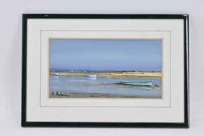 tableau représentant un bateau sur la plage, encadré et accroché au mur