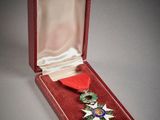 an image of a red box with a medal in it