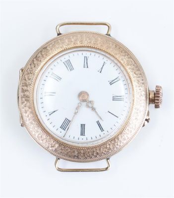 a gold watch with roman numerals on the face