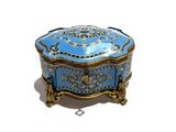a blue and gold box sitting on top of a white table