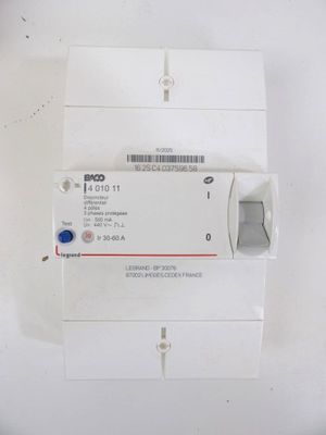 a white box with a label on it that is attached to a device