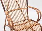 an image of a wicker rocking chair on a white background