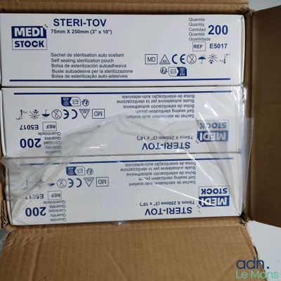 two boxes of medical supplies are stacked on top of each other