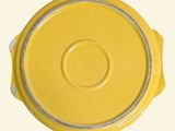 a yellow lid on a yellow bowl on a white background