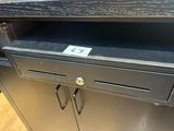 an image of a black metal cabinet with a drawer