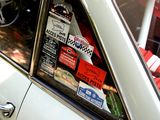 a car that has a lot of stickers on the window