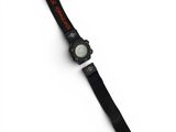 a close up of a watch on a white surface with a black strap