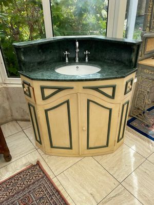 a bathroom with a sink and a window in it