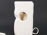 a white object with a hole in the middle of it