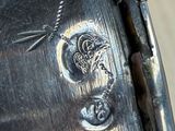 a close up of a metal object with a chain on it