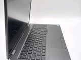 a laptop computer that is sitting on a white table