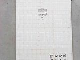 a white tile on the floor with writing on it