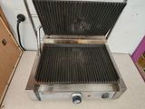 a close up of a grill on a counter top