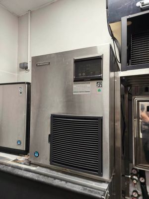 a man that is standing in front of some ovens