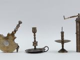 several different types of brass objects are displayed on a white surface