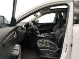 the interior of a car with the door open and the driver ' s seat down