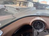 a view of a dashboard from inside of a car